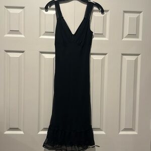 Black midi cocktail dress with chiffon straps and trim